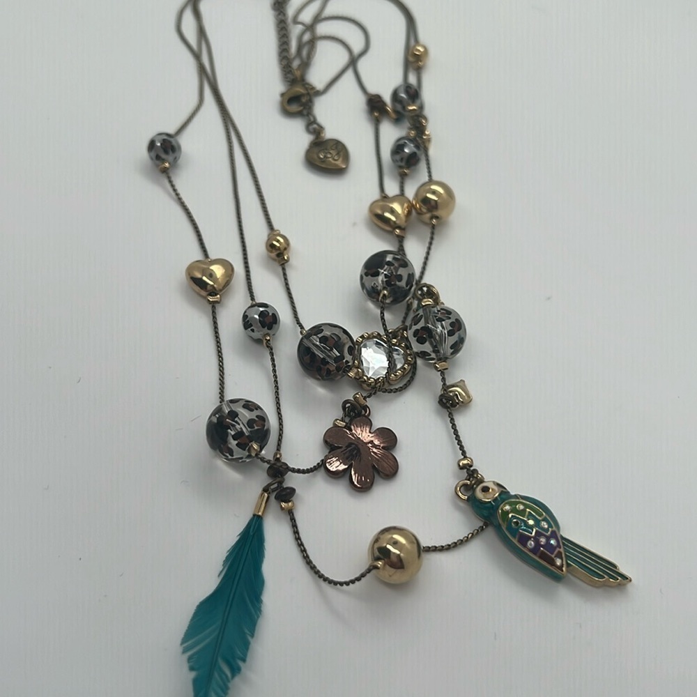 Betty Johnson leopard parrot necklace. It is missing one feather.
